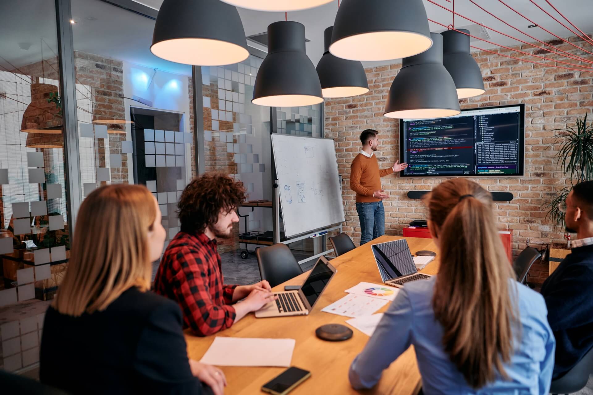 An image of a team meeting in a conference room for the blog post, does chatgpt generated text hurt your seo
