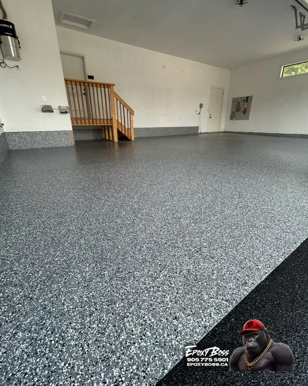 Muskoka polyaspartic garage coating with neutral flake blend.