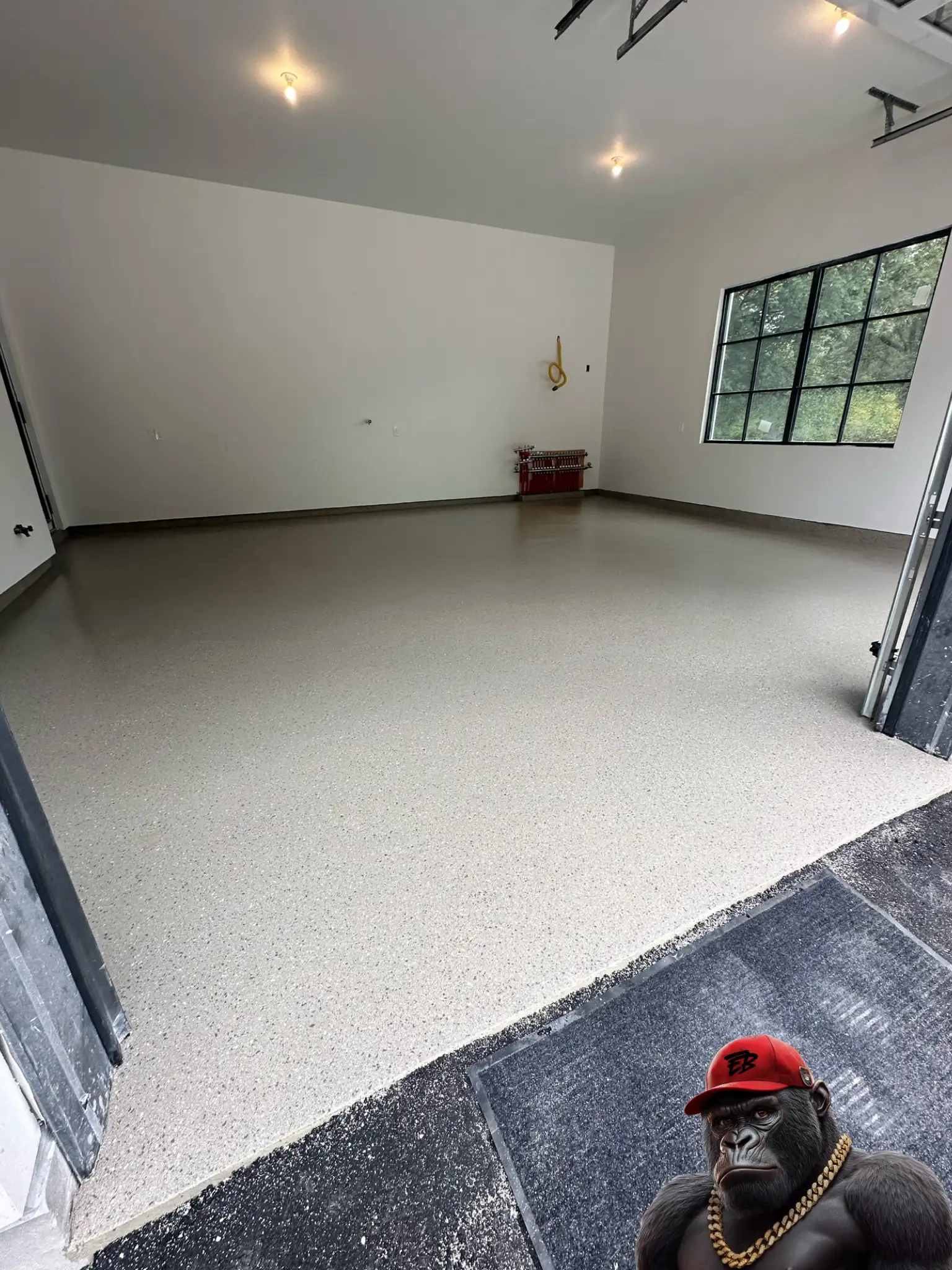 Epoxy flake garage floor coating installed in Innisfil Ontario home.