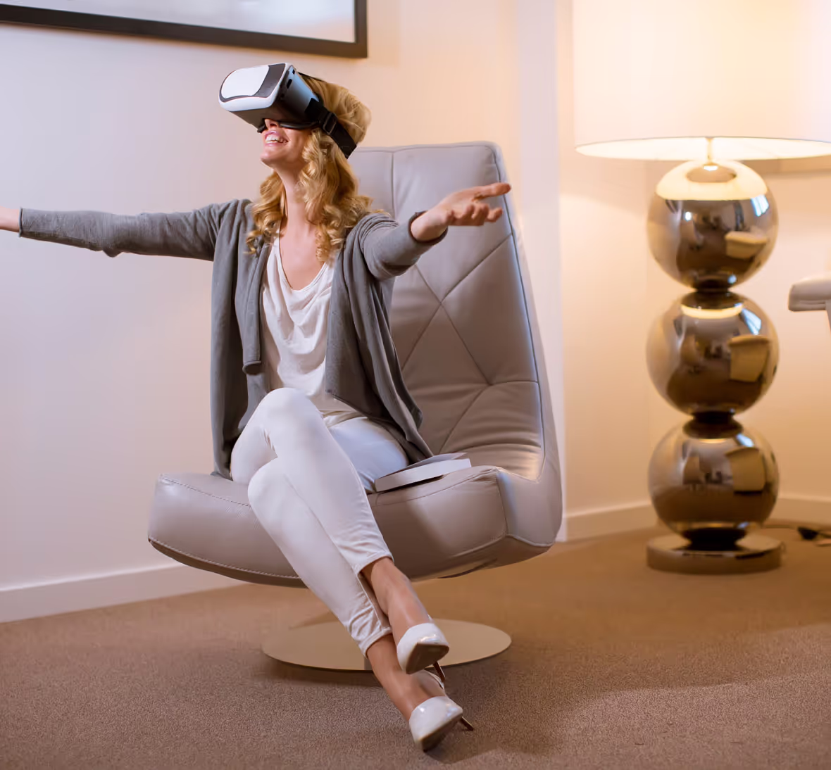 woman wearing vr headset sitting on chair