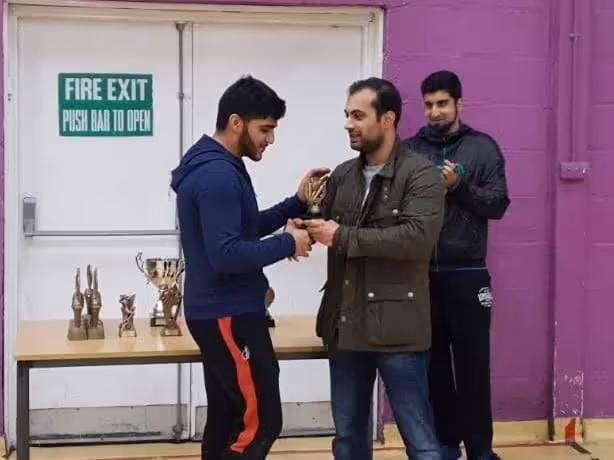 Haroon Tariq receiving the runners up Trophy Molvi Sixers BBICL 2018