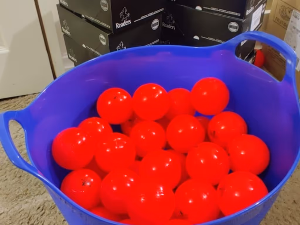 Large Tub filled with Readers Cricket Windballs funded by Sport England