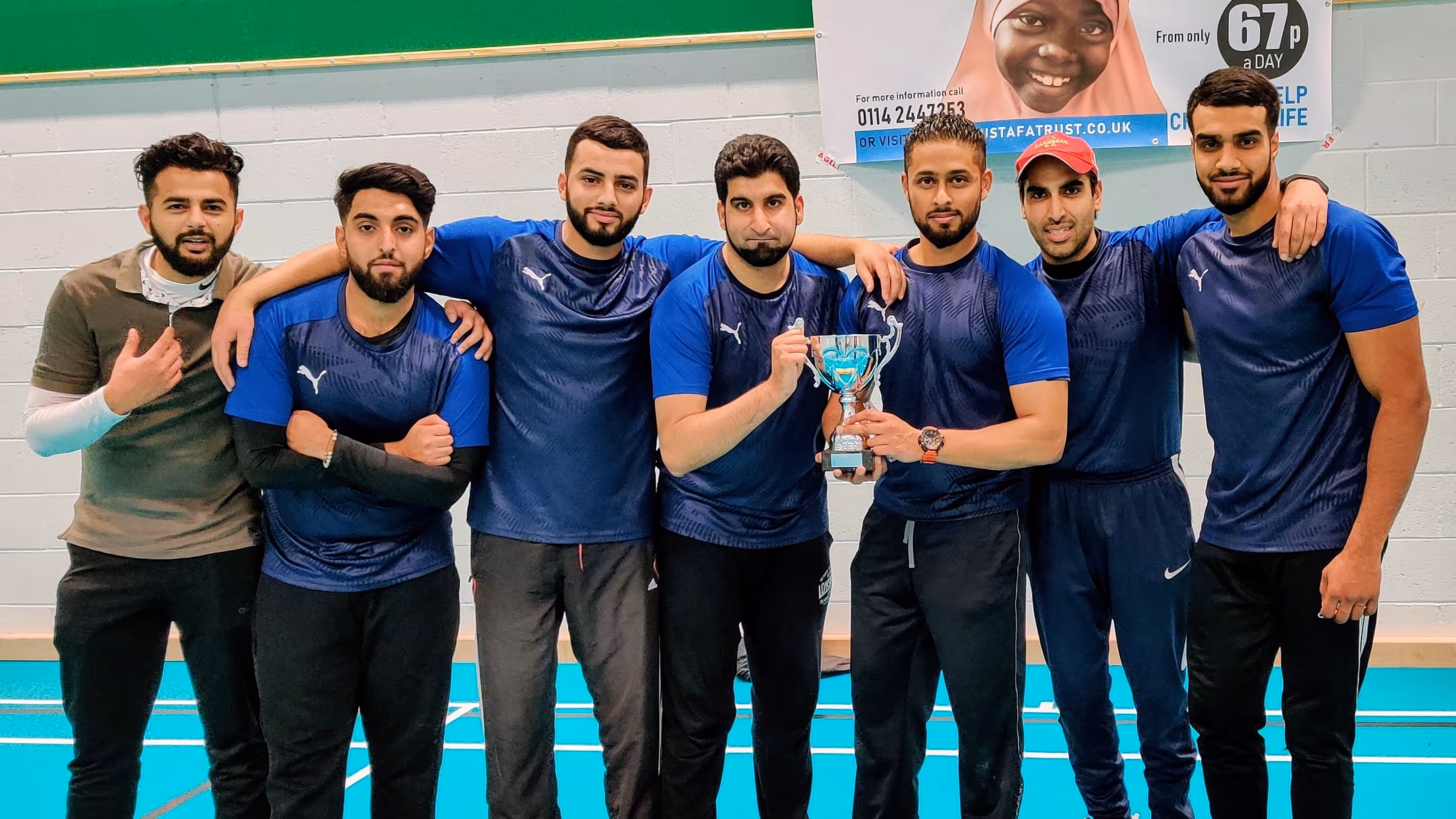 Winners Hit & Run Pose with Big Bash Indoor Cricket League (BBICL) Trophy 2019 at Astrea Academy Sheffield, showcasing team unit and success