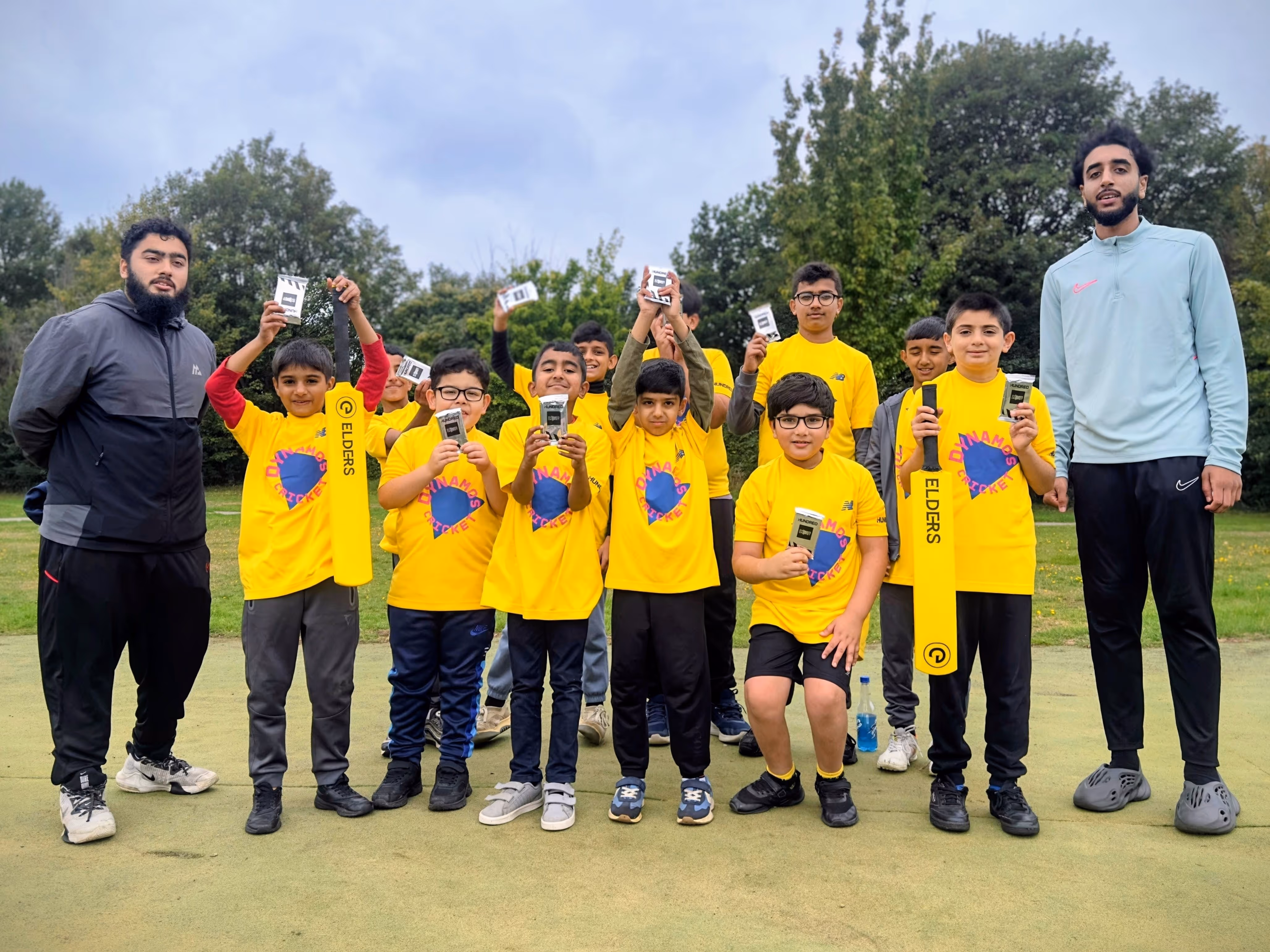 ECB Core Coaches stand aside a celebratory group of Dynamos Cricket Participants at the last session in Firth Park during summer 2025, organised by Cricket Arena CIC