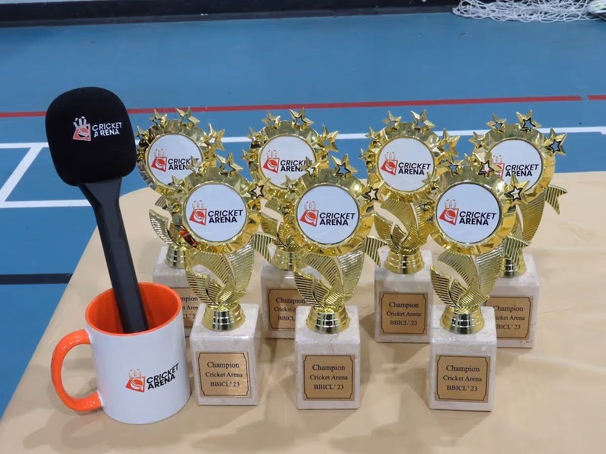 Big bash indoor cricket league trophies aligned on table ready to be presented to winners