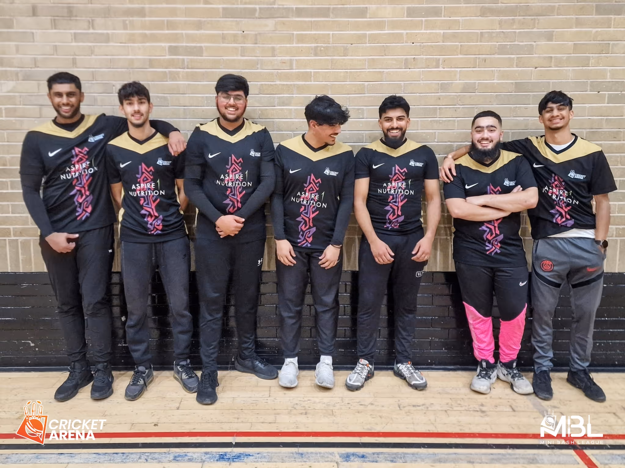 Players smile stood alongside each other in kits during a Team photo shoot