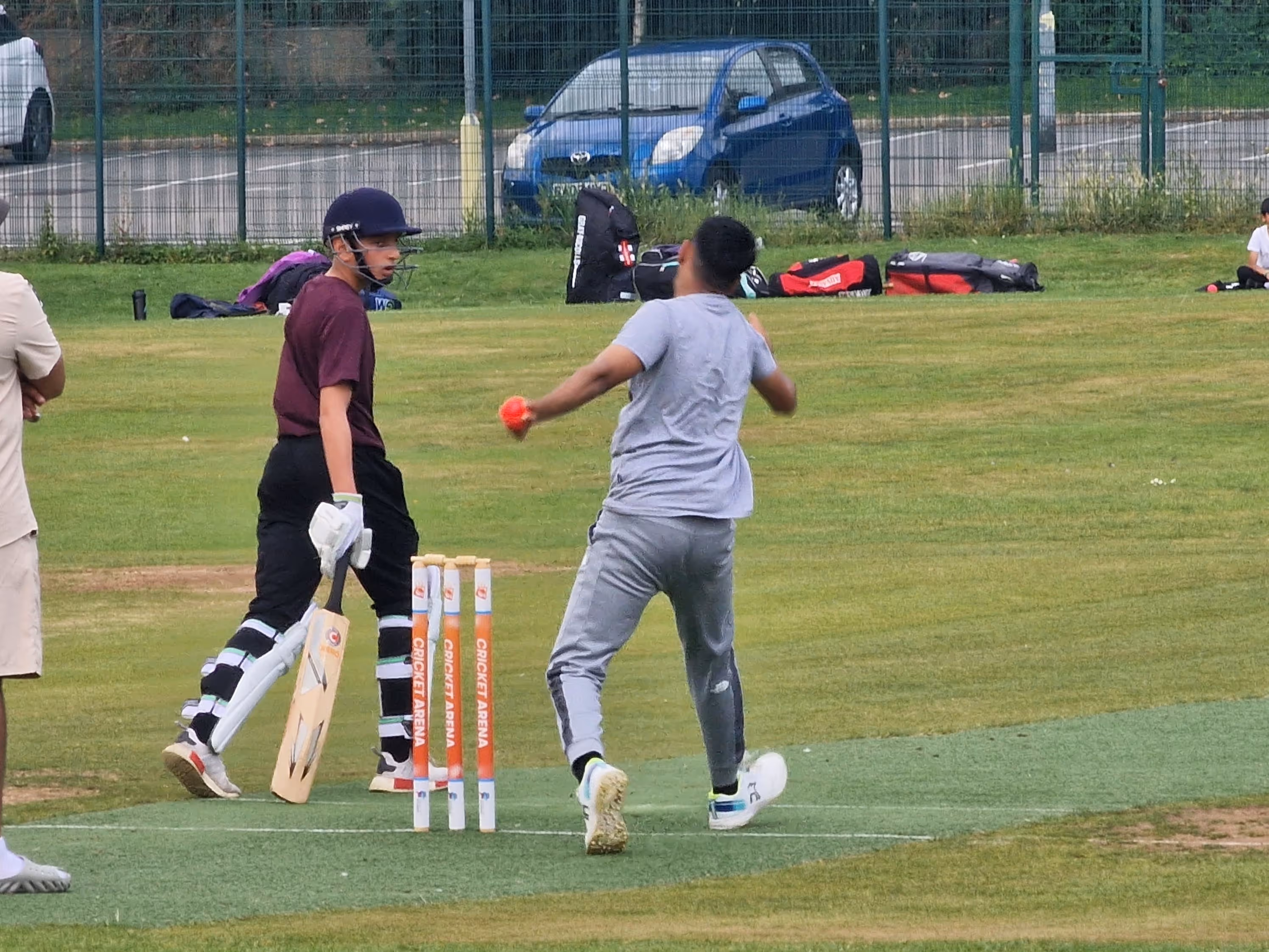 young bowler rolls his arm over as he bowls during a youth Hundred match at Shiregreen cricket club sheffield
