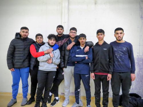 Finalist team pose together after match showing friendship, unity and community spirit in indoor cricket Sheffield