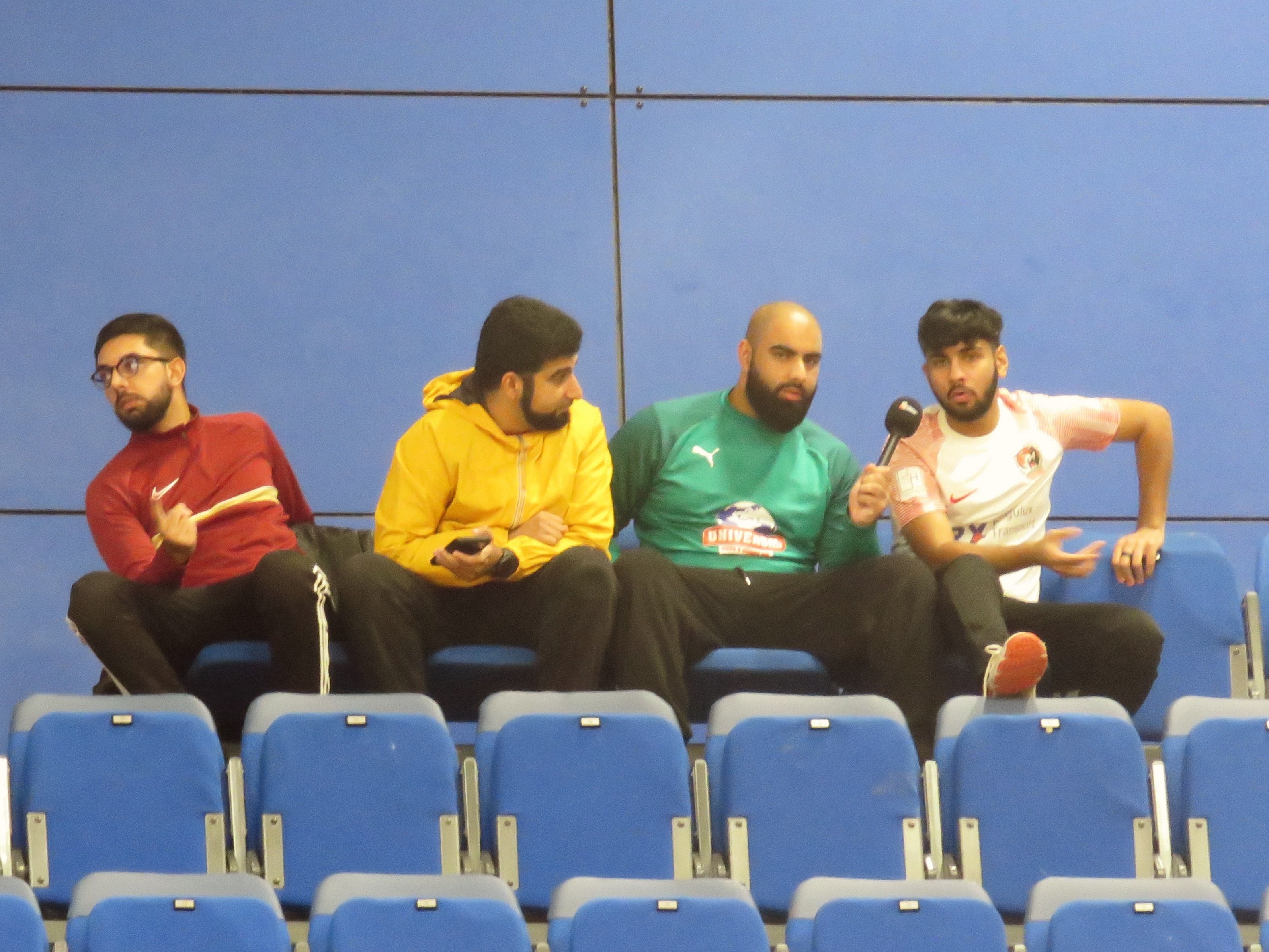 Spectator records indoor cricket match at EIS, capturing the atmosphere and share-worthy moments.