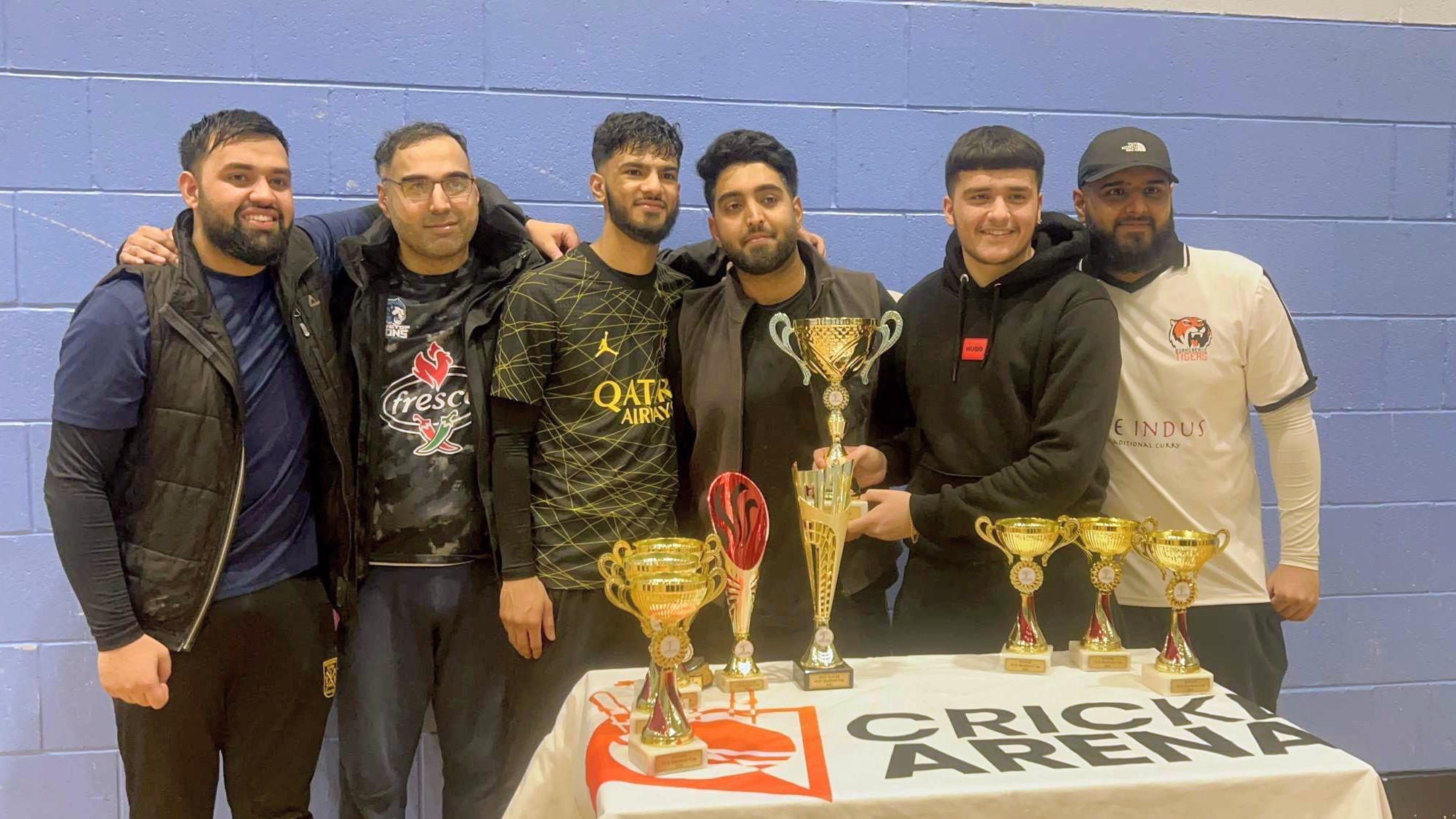 Sheffield Cup 2023 winners posing proudly with their trophies on the Cricket Arena presentation table before lifting the cup.