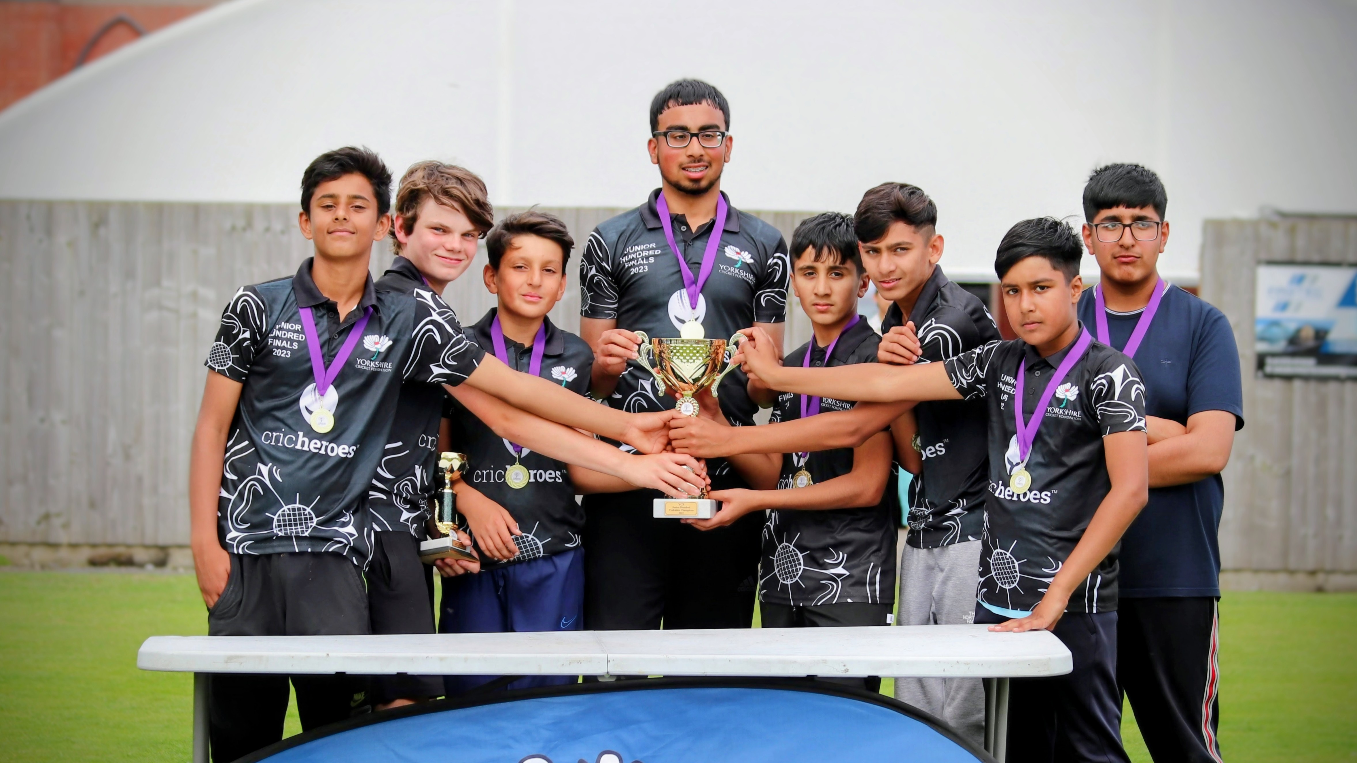 Sheffield’s Sharrow Stars celebrate with the trophy after winning the Yorkshire Junior Hundred 2023 at Park Avenue, Bradford.
