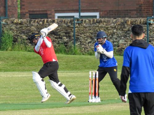 Wicketkeeper takes the ball cleanly as the batter misses during the Cricket Arena Red v Blue Youth Hundred match.