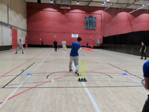 Player hits a powerful shot during MBL 2023 at Concord Sports Centre, showcasing Sheffield youth indoor cricket in action.