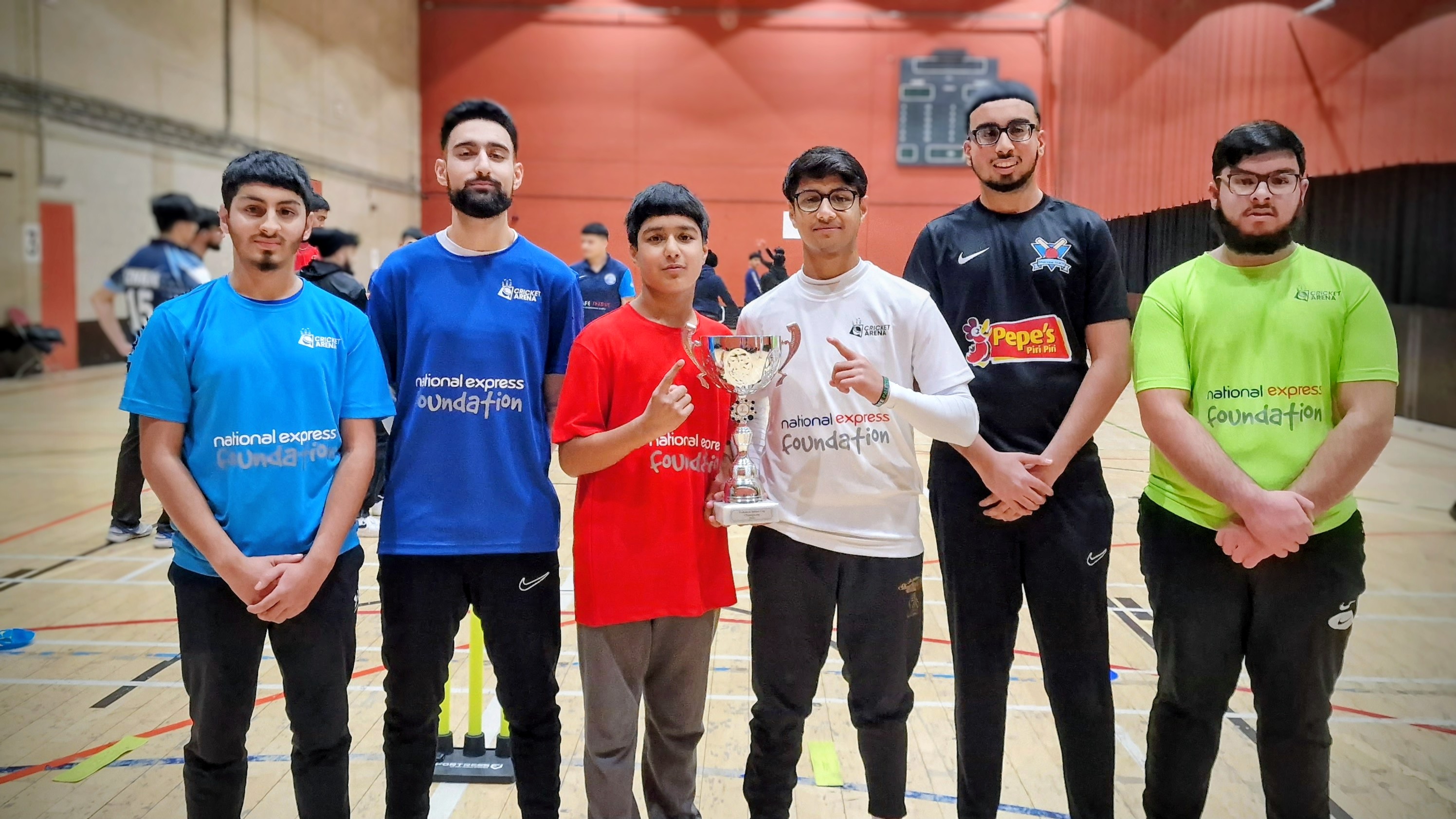 Six team captains in National Express Foundation kits hold the MBL 2023 trophy at Concord Sports Centre, Sheffield.