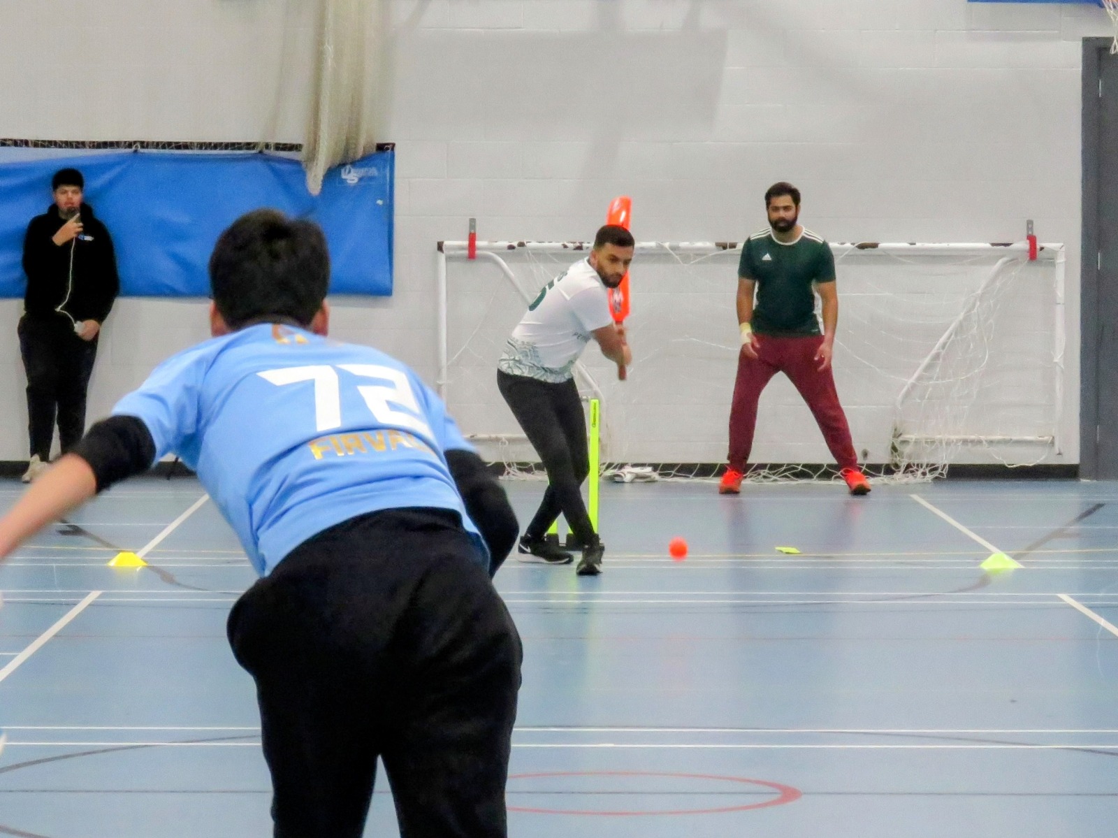 Umpire view as Hamzah Younis sets to play—anticipation and composure for Firth Park Warriors in the BBICL 2023 final.