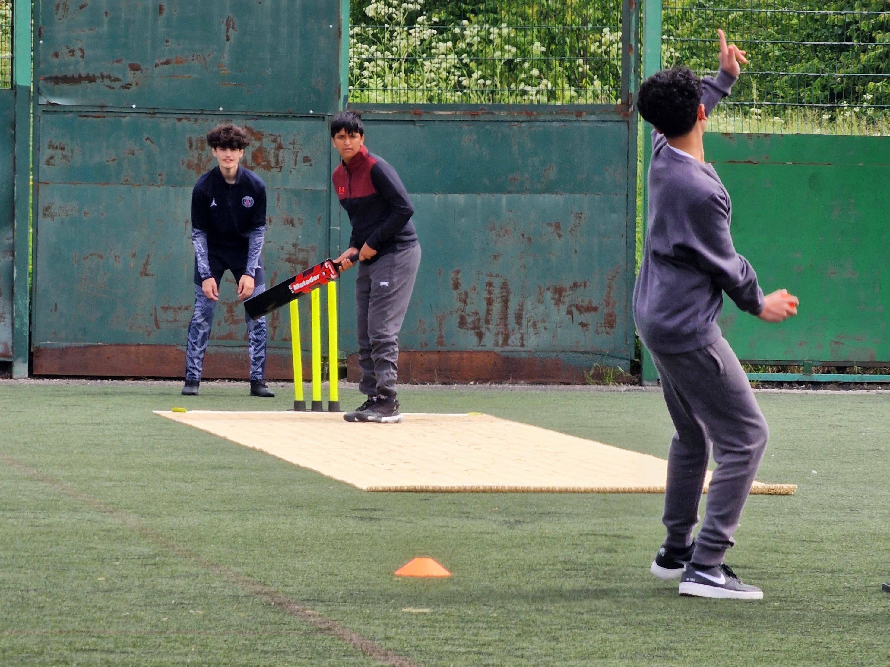 Windball bowler releases as the batter sets on the Flicx 2G pitch during Junior Hundred 2024.