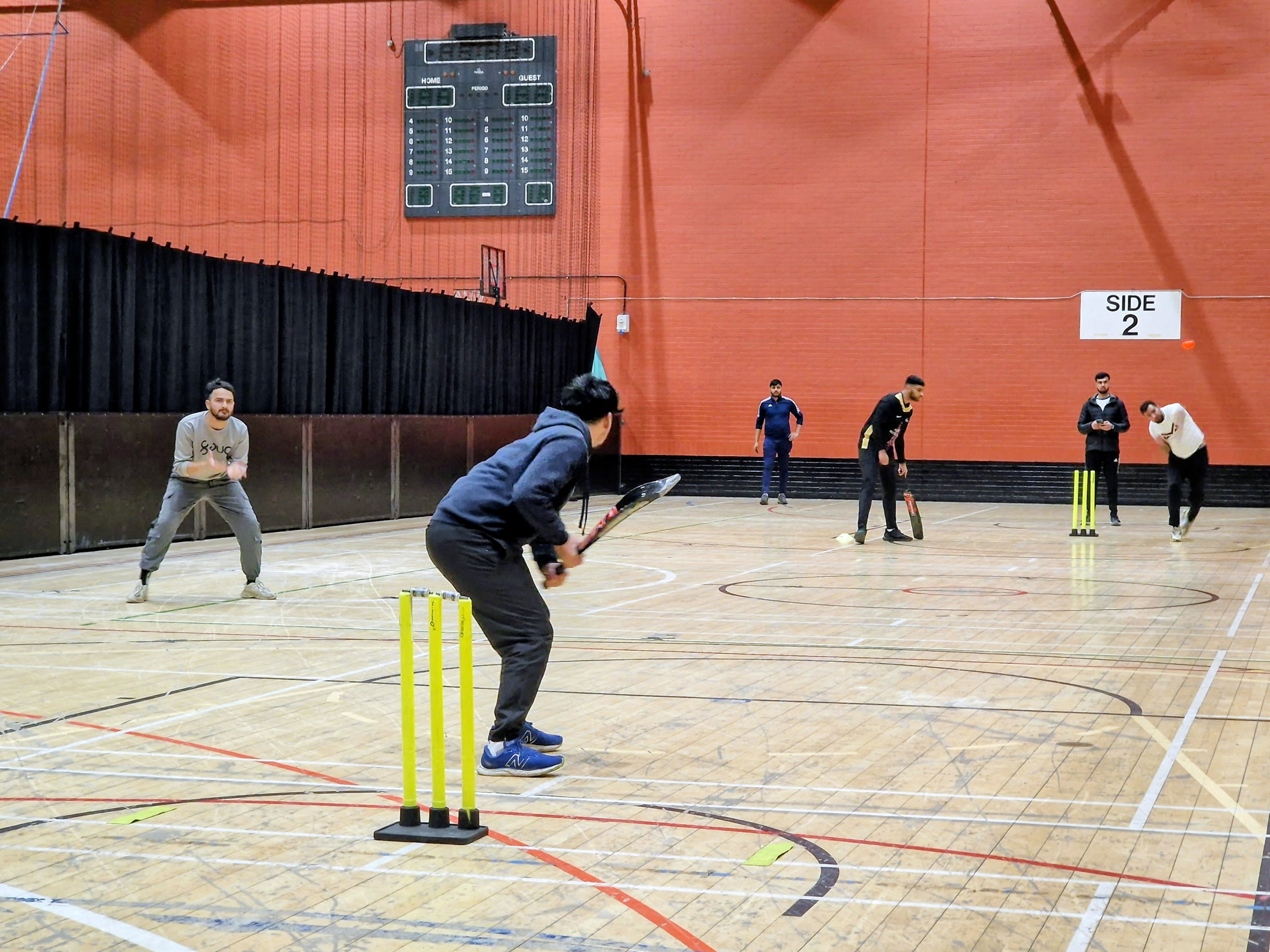 Indoor bowler runs in to deliver the ball during a Sheffield Cup 2025 match at Concord Sports Centre in Sheffield.