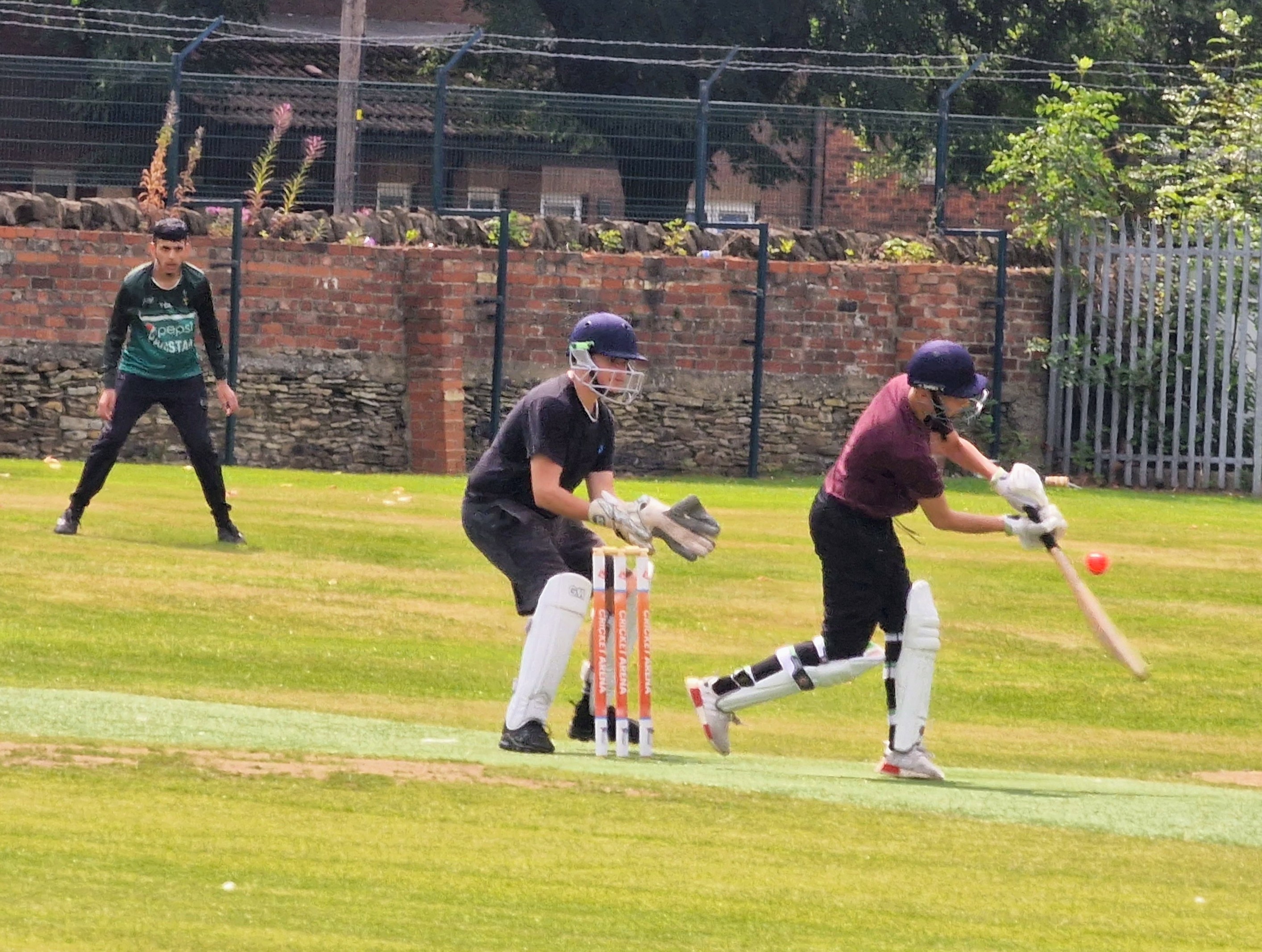 A young player drives the ball through the off side during a youth hundred match at Shiregreen, showing growing confidence at the crease.