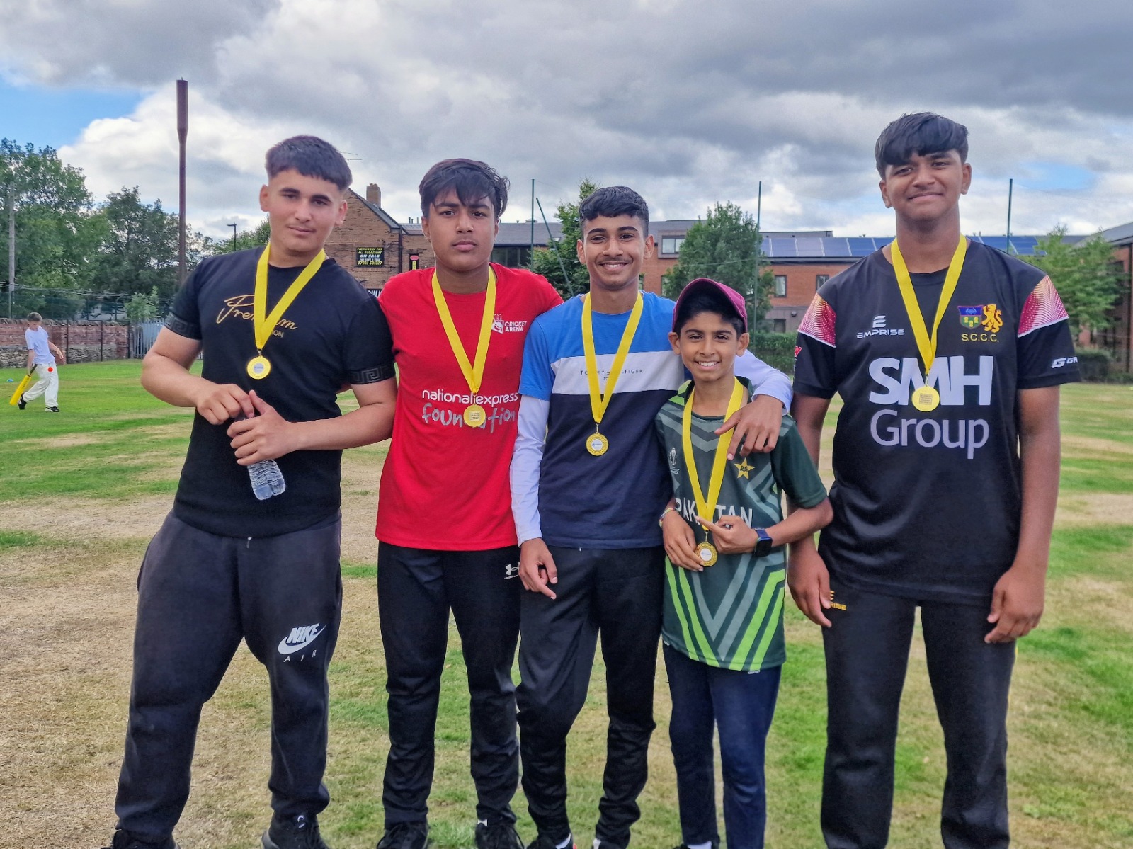 Junior Hundred 2025 players of the match from different teams stand together at Shiregreen Cricket Club in Sheffield wearing their medals.