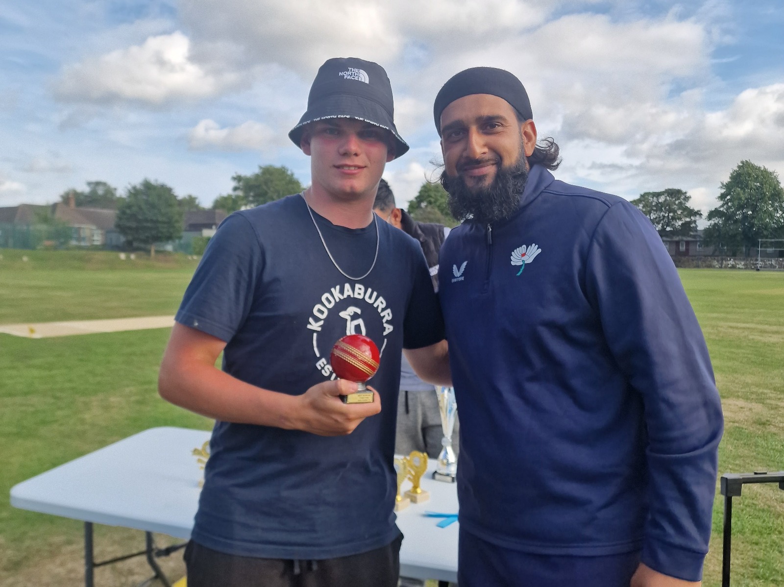 Yorkshire Cricket Foundation staff member presents the Best Bowler award to a junior player at Junior Hundred 2025 in Sheffield.