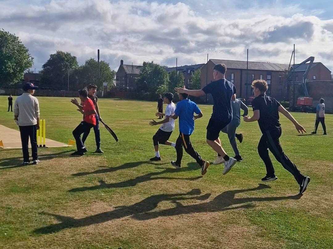 Sharrow Stars players sprint onto the pitch to celebrate winning Junior Hundred 2025 at Shiregreen Cricket Club in Sheffield.