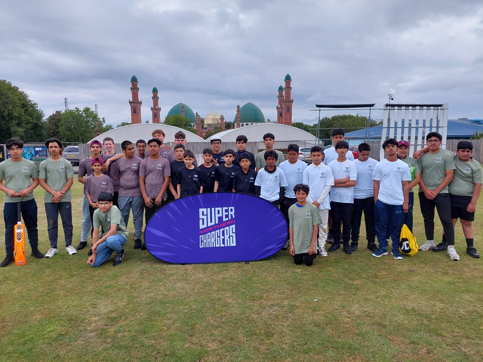 Junior Hundred teams from Sheffield, Bradford, Leeds and Kirklees gather for a group photo at Park Avenue, Bradford.