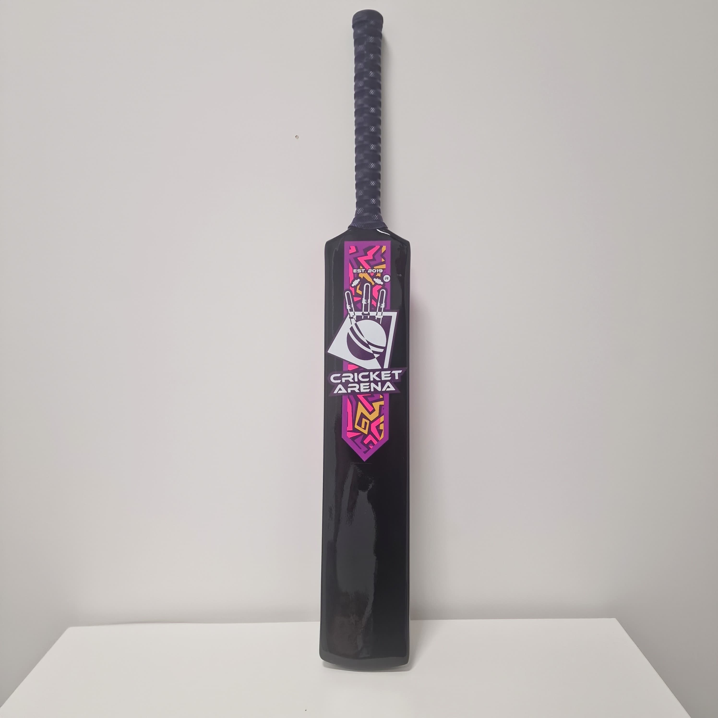 Exclusive Cricket Arena fibreglass cricket bat in pink, purple and black — lightweight, durable, built for softball, tapeball, windball and beach cricket.