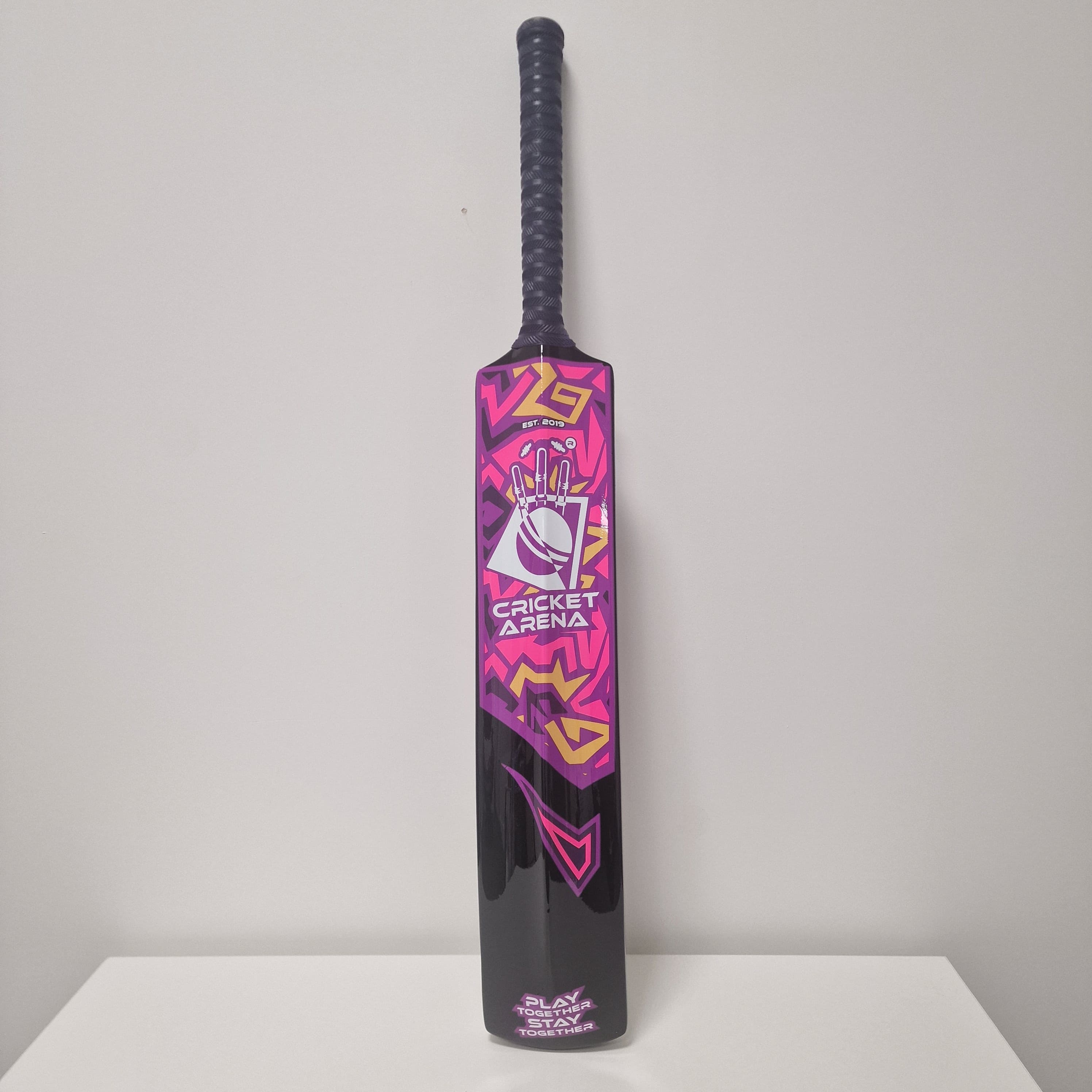 Exclusive Cricket Arena fibreglass cricket bat in pink, purple and black — lightweight, durable, built for softball, tapeball, windball and beach cricket.