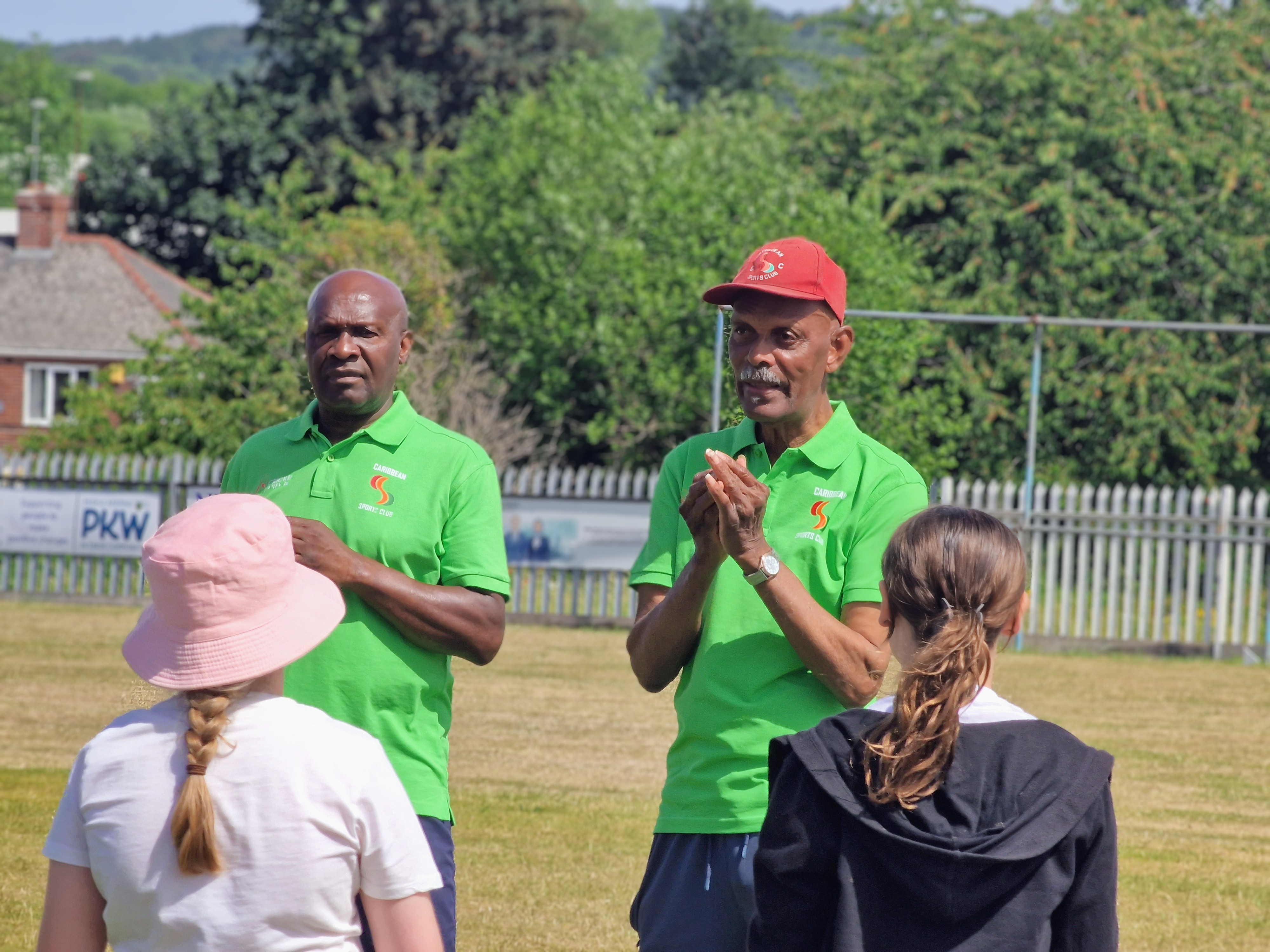 Club elders demonstrate cricket skills to schoolchildren at Sheffield Caribbean Sports Club on Windrush Day 2026