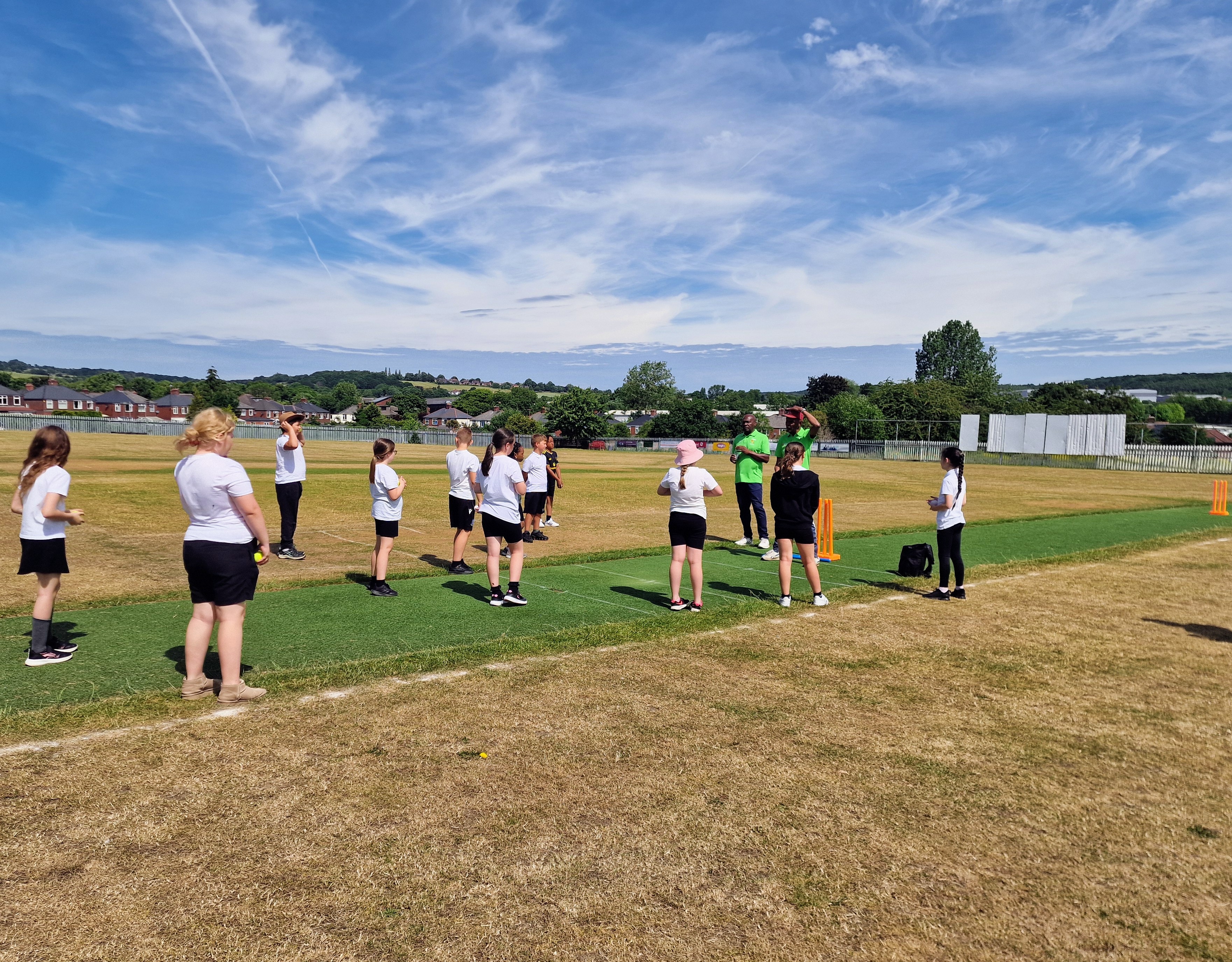 Schoolchildren from three Sheffield primary schools take part in a cricket session at the Caribbean Sports Ground
