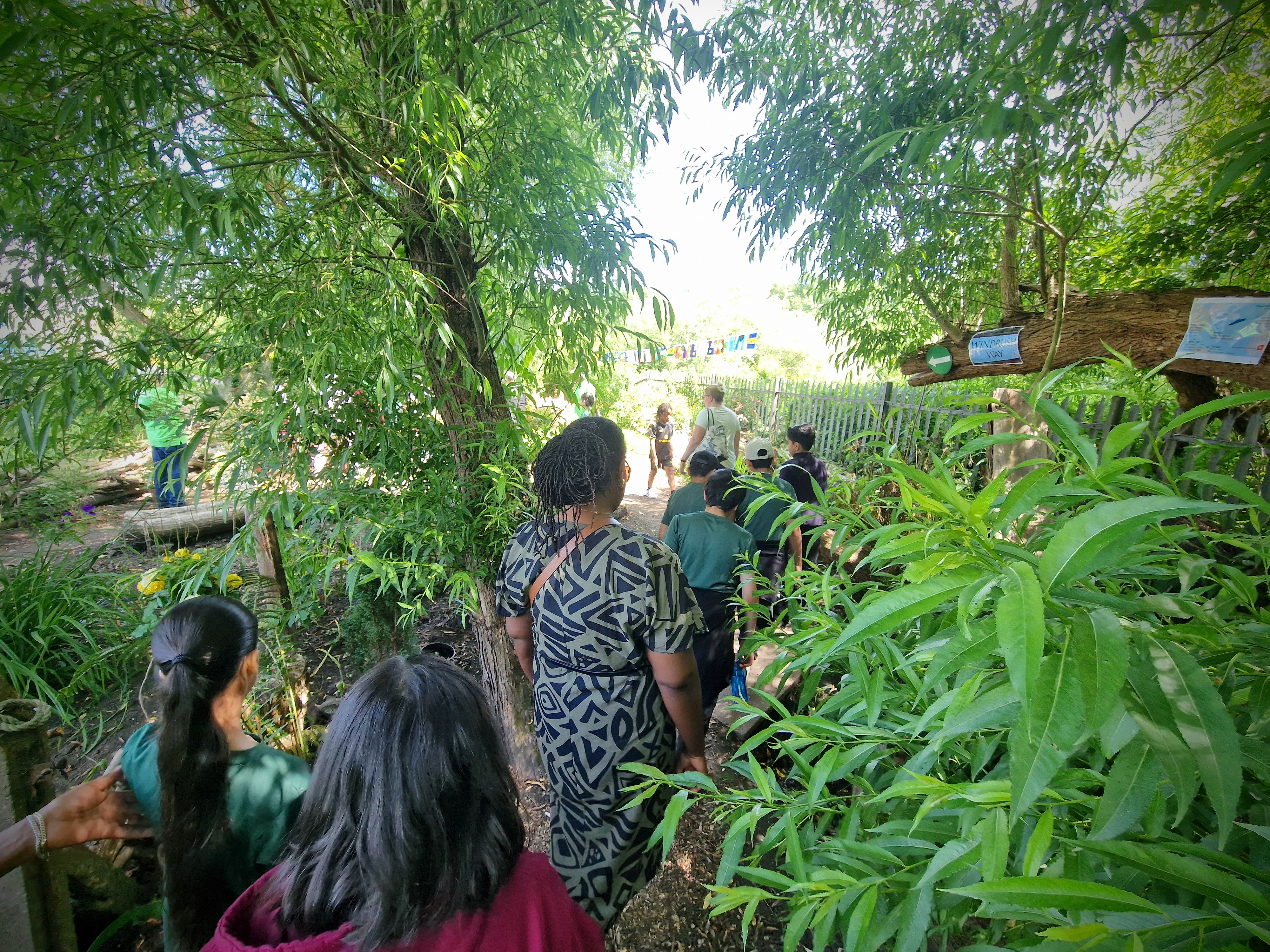 Children follow the Windrush Trail through the Legacy Garden at Sheffield Caribbean Sports Club