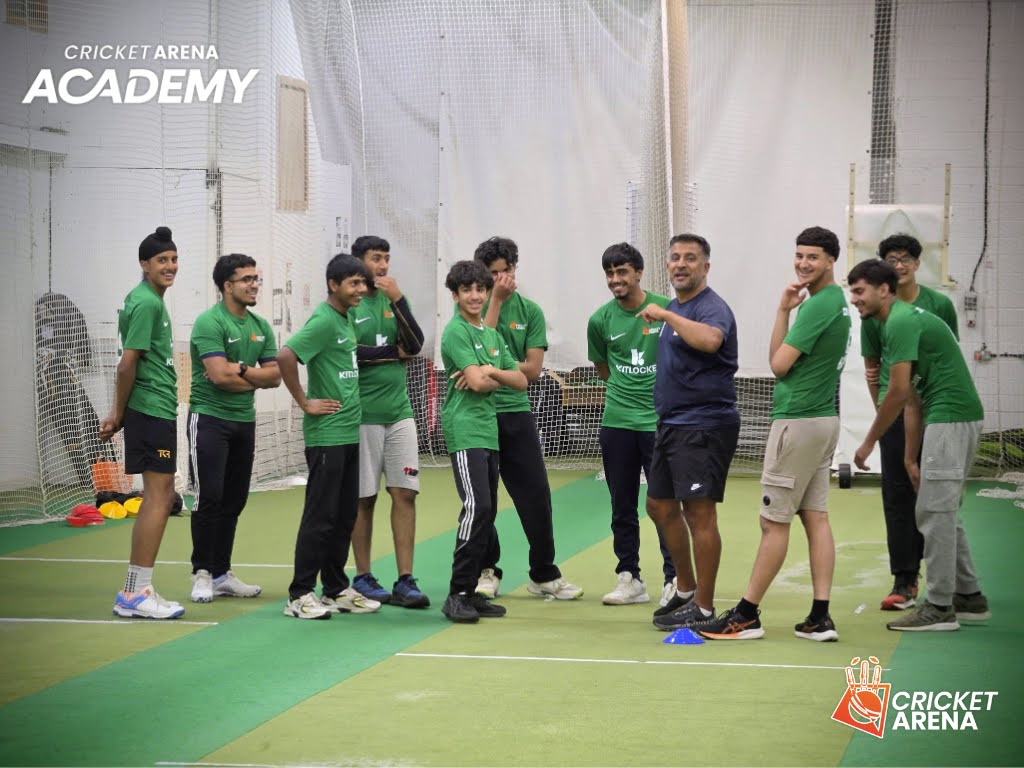 Academy players gather round their coach at the indoor centre in Sheffield, setting the standards behind Cricket Arena's boys 15–18 squad.
