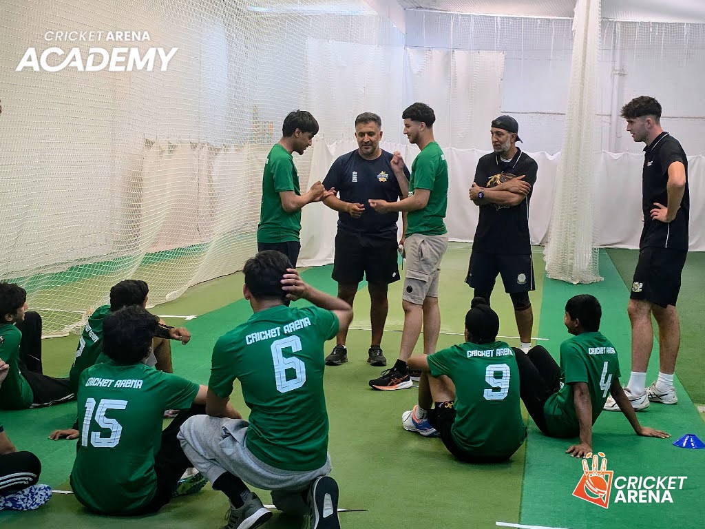 A coach gives feedback to Academy players between drills in Sheffield, the individual attention that moves promising cricketers towards county level.
