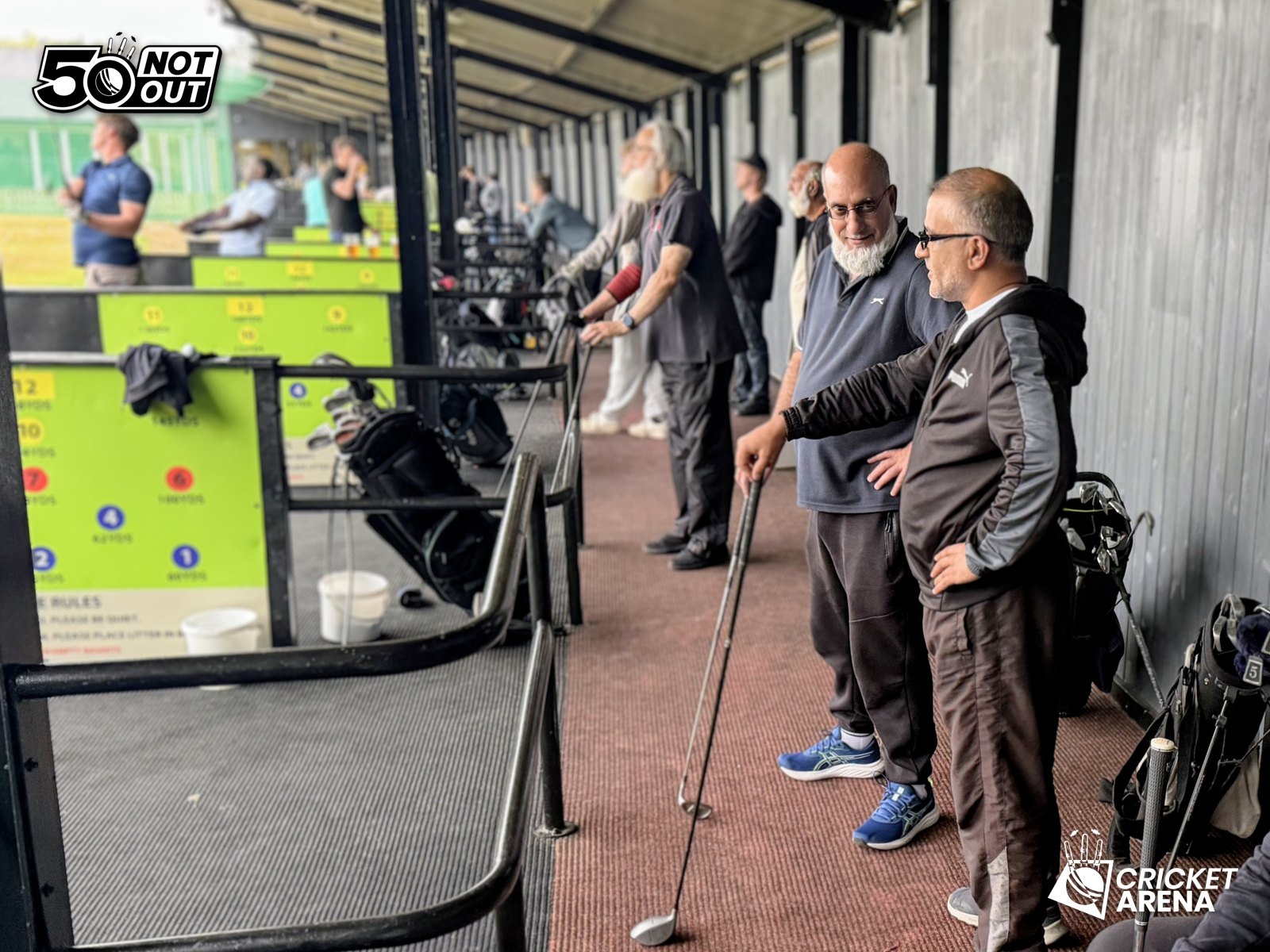 50 Not Out members chat between shots at Moorview Golf Centre, Sheffield — golf as a game to play and talk.