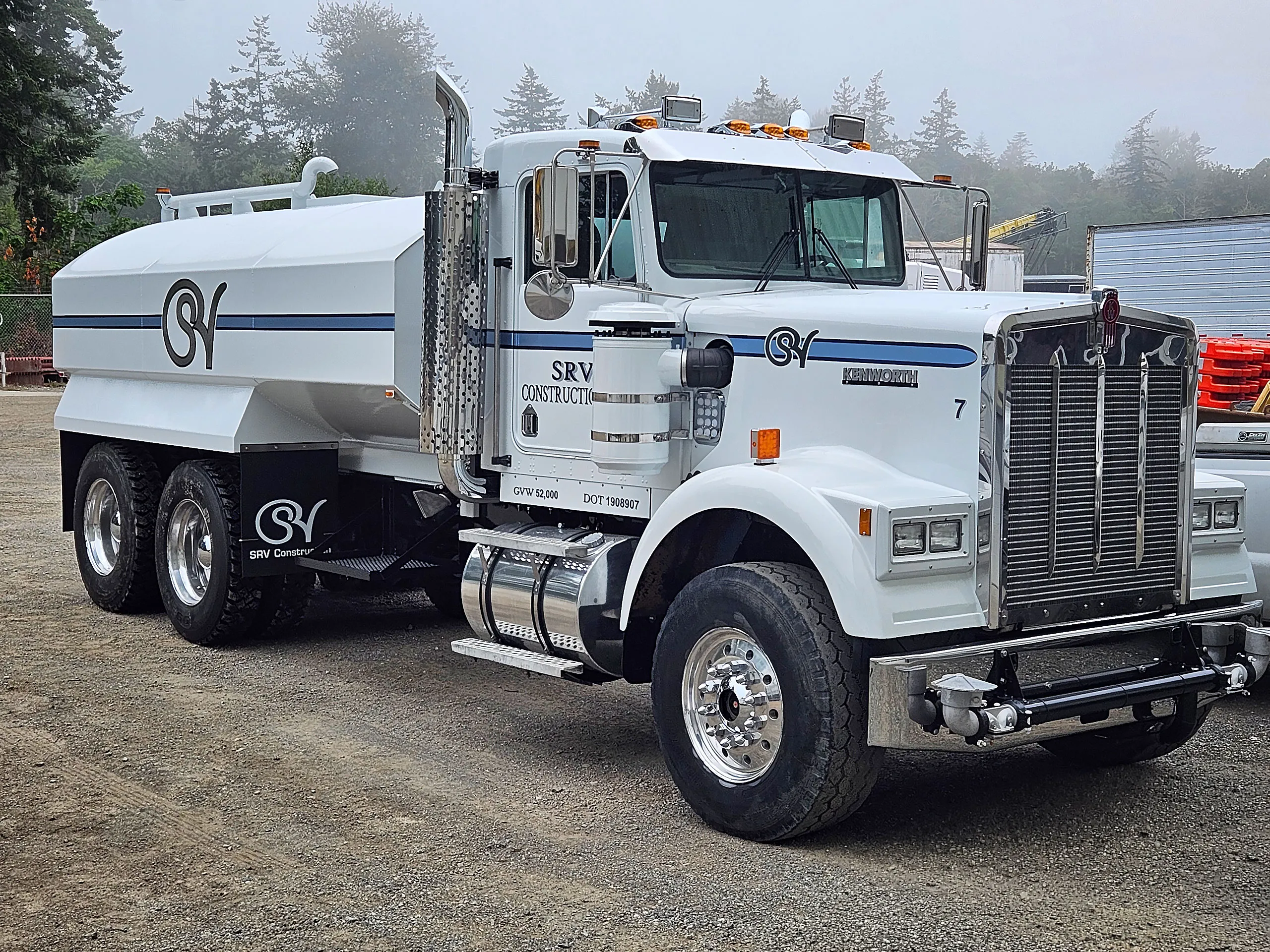 A white truck with the letters SVR on the front.