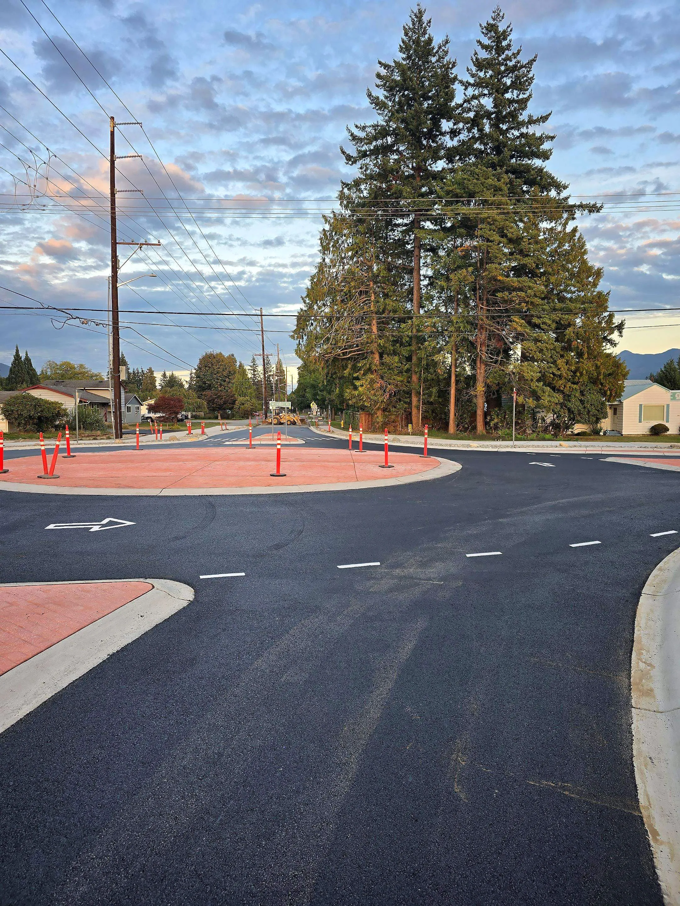 A black street with a red circle in the middle.