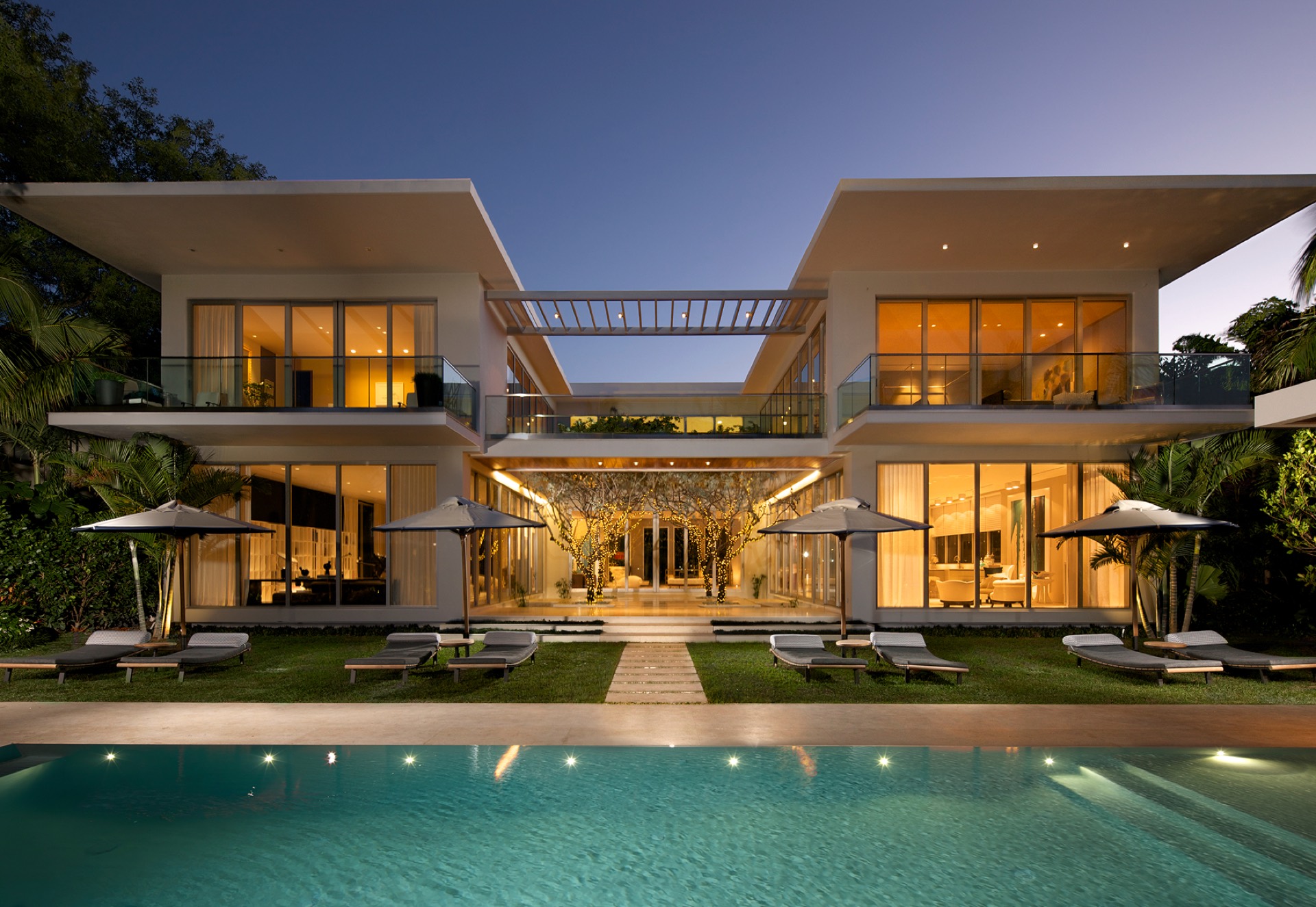 Sunset Residence — sliding glass walls along the rear elevation
