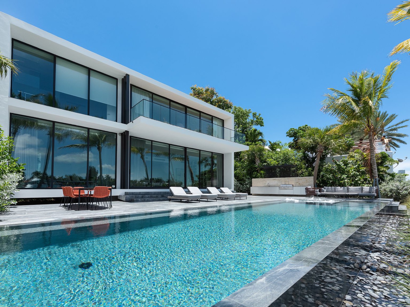 Luxury Palm Beach waterfront estate with impact glass and pool terrace