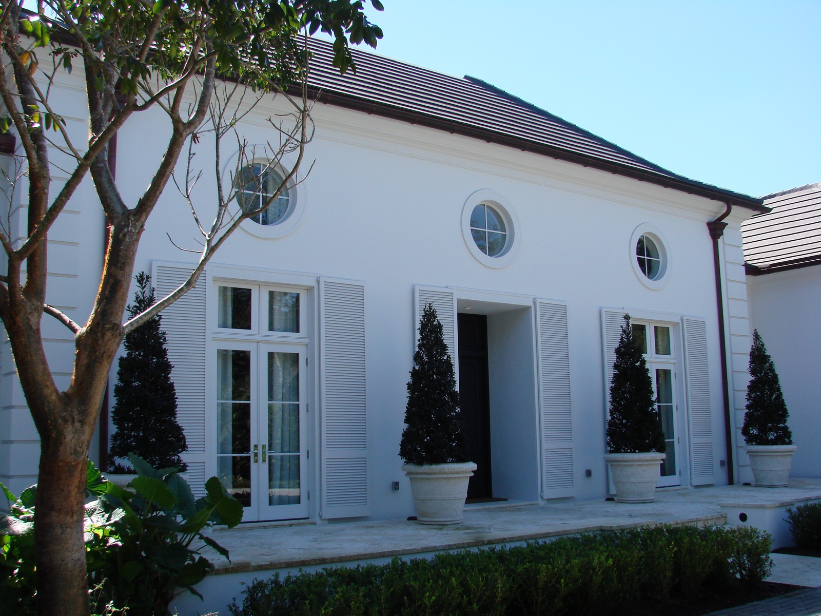 Traditional white estate home with classic windows