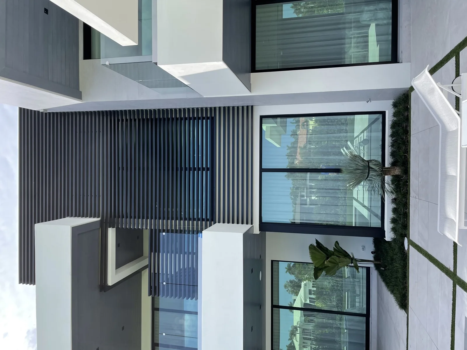 Floor-to-ceiling window wall framing the view