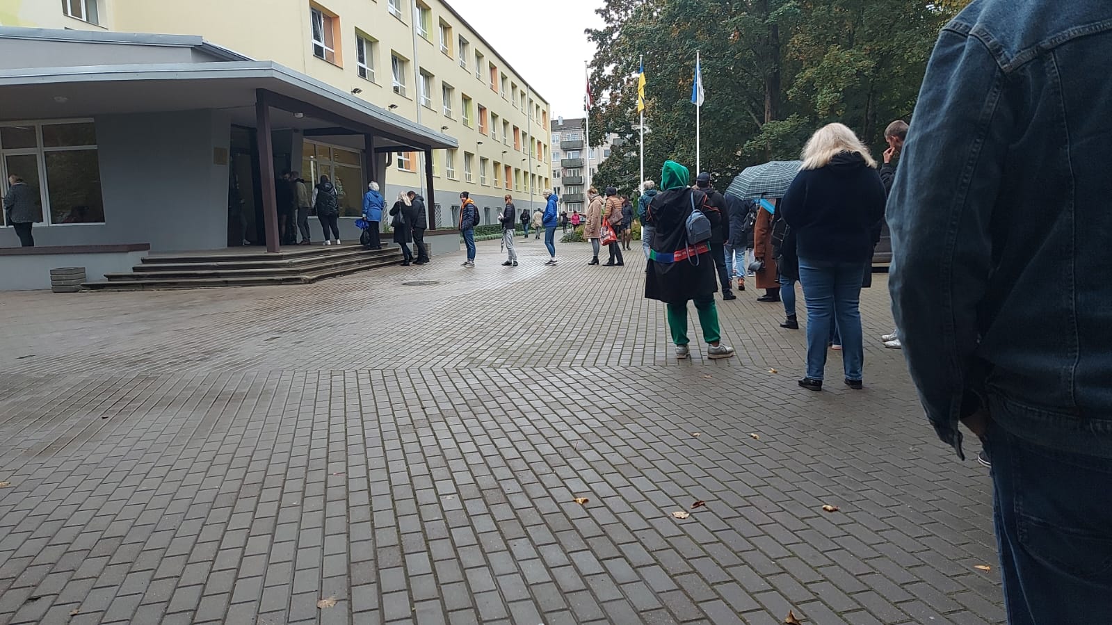 A queue of voters at a polling station in Rīga during Latvia's 2022 parliamentary election