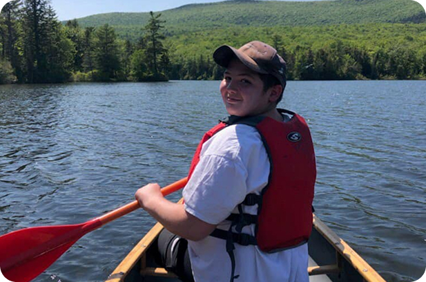 TMPUV mentee padding canoe on pond