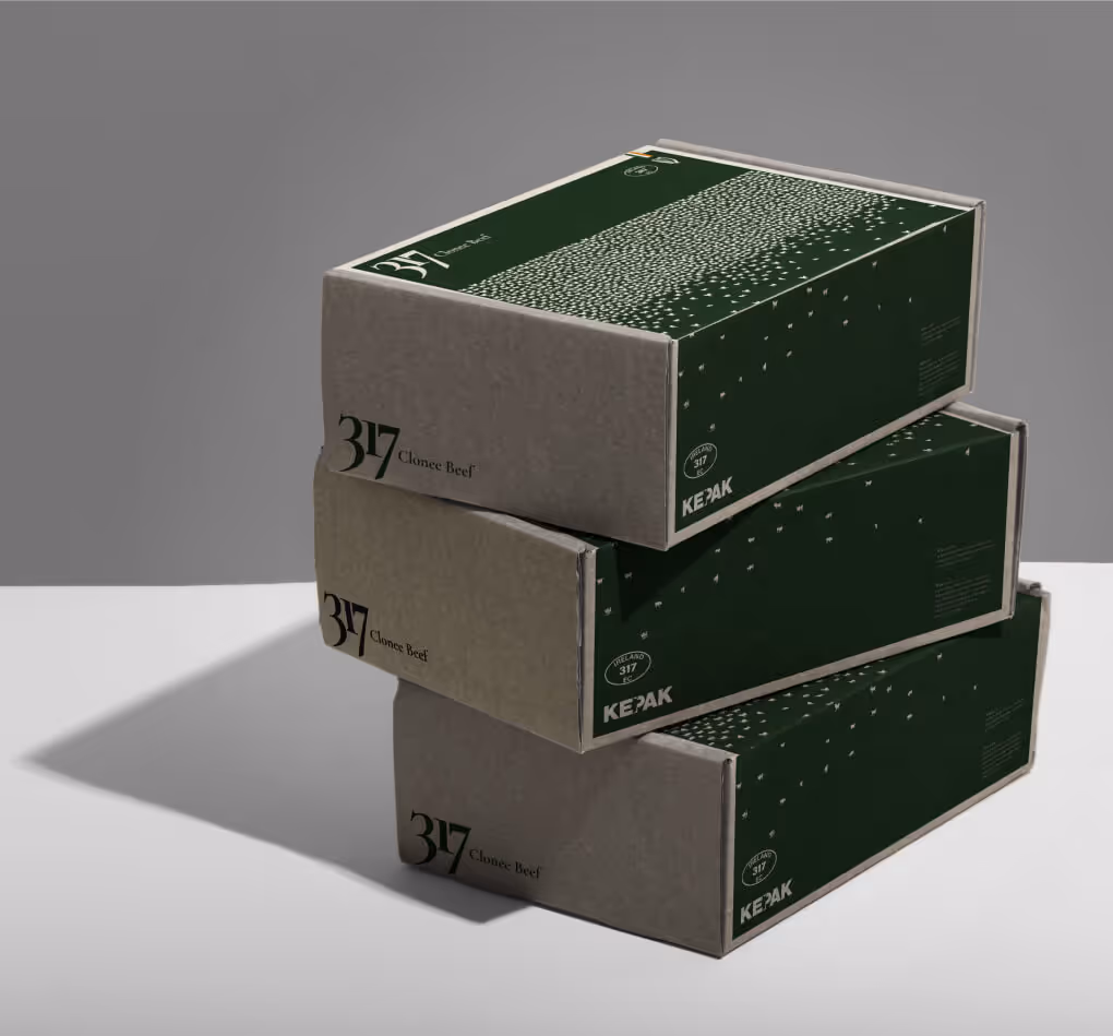 Packaging boxes from concept B, covered in a pattern of small bull silhouettes.