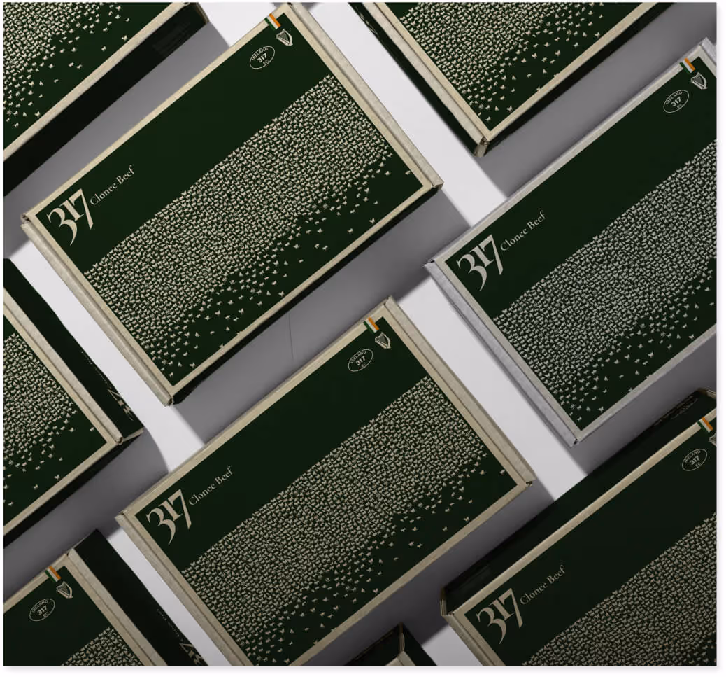 Packaging boxes from concept B, covered in a pattern of small bull silhouettes.