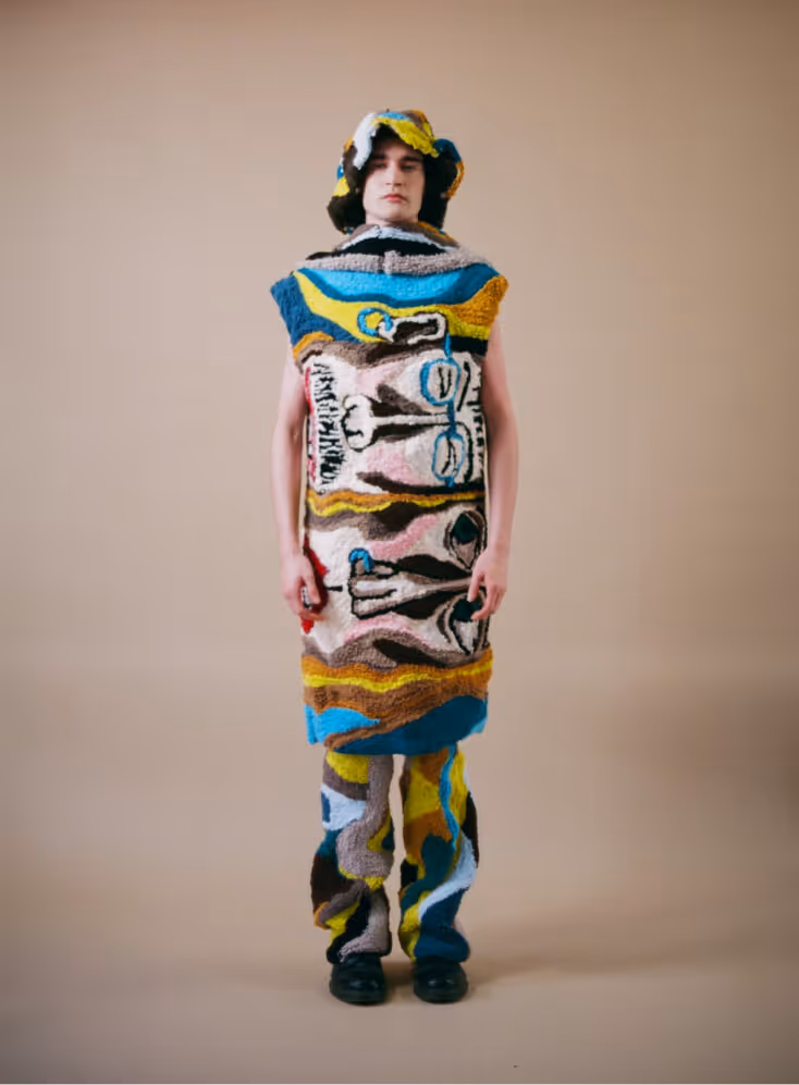 Model wearing tufted sculpture from "I'll be at yours in 5" series. 