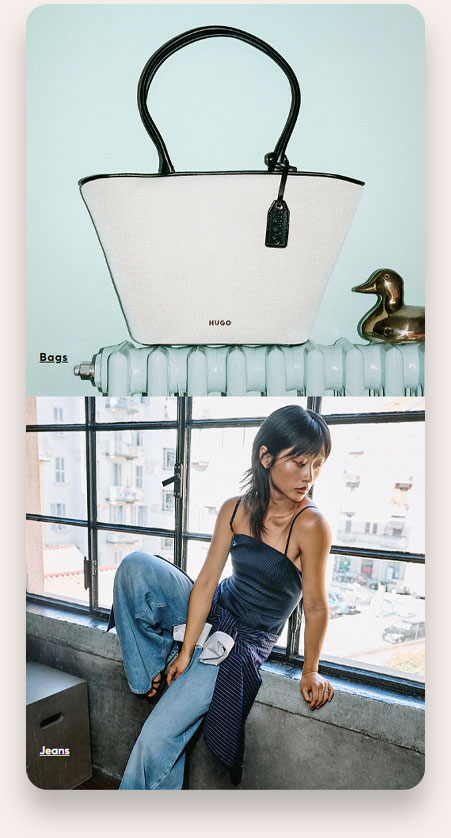 White HUGO handbag with black handles placed on a white radiator next to a brass duck figurine, above an image of a woman with straight dark hair wearing a black sleeveless top and light blue jeans sitting on a concrete windowsill in front of large industrial-style windows overlooking a cityscape.