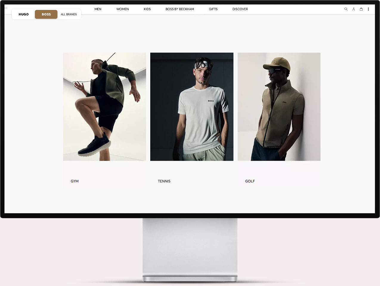 Website screenshot showing three images of men modeling BOSS brand sportswear for gym, tennis, and golf, with a navigation bar and brand selection at the top.