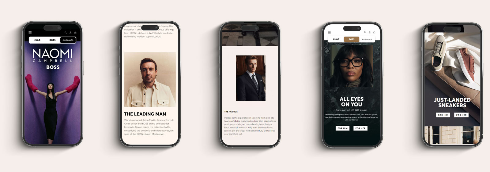 Five smartphones display different fashion-related web pages: 1) Naomi Campbell BOSS promotion with a woman in a black dress and red gloves on purple background; 2) Profile of Fernando Alonso with description titled 'THE LEADING MAN'; 3) Description and image of a man in a suit under 'THE FABRICS' heading; 4) Woman wearing glasses with text 'ALL EYES ON YOU' and buttons for him or her; 5) Shoes on a couch with text 'JUST-LANDED SNEAKERS' and buttons for him or her.