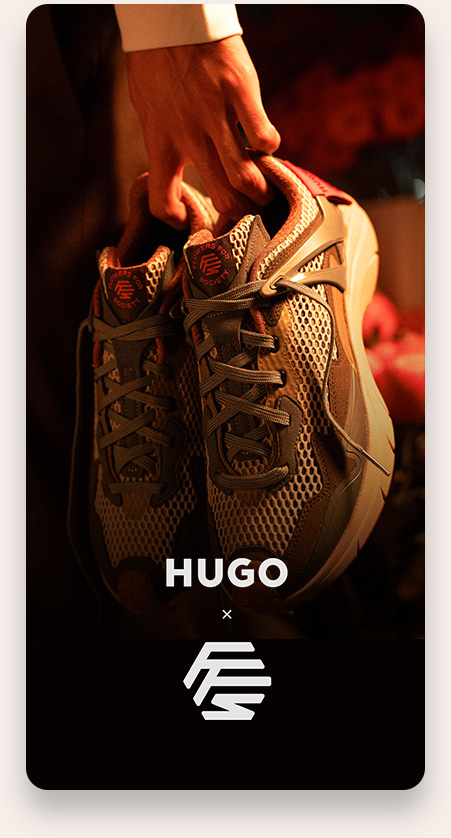 Hand holding a pair of brown and beige mesh sneakers with dark gray laces, featuring the logo and text 'RUNNERS FOOT SOCIETY' on the tongues, against a dark background with 'HUGO' and a stylized logo below.