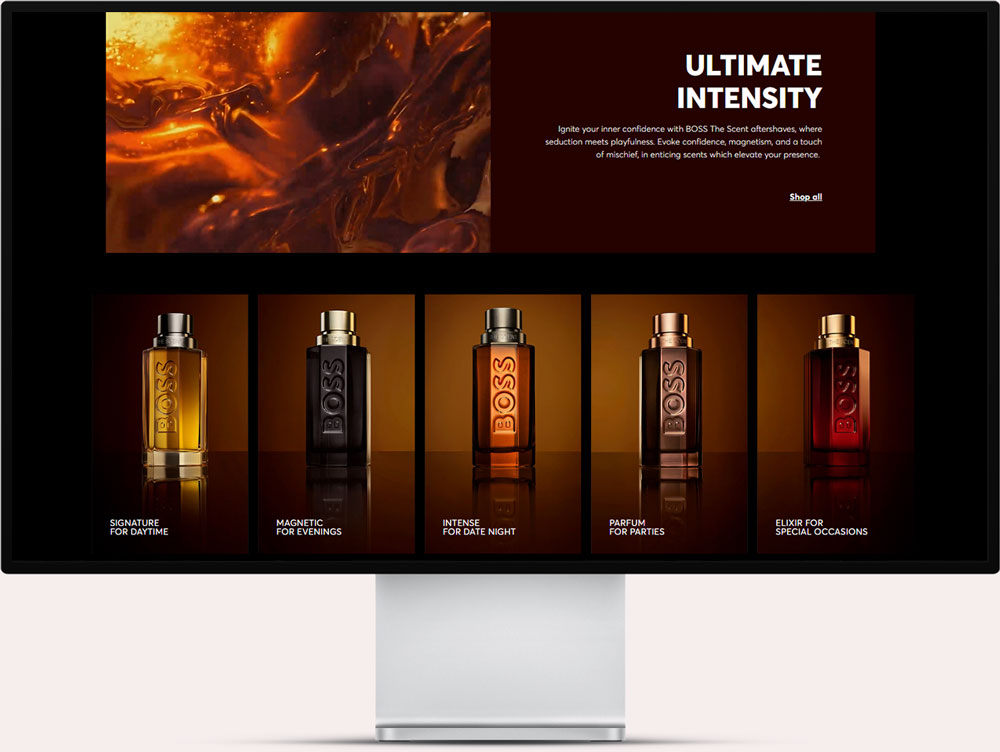 Computer screen showing a fragrance ad titled 'Ultimate Intensity' with BOSS The Scent aftershaves, featuring five bottles labeled for different occasions: signature for daytime, magnetic for evenings, intense for date night, parfum for parties, and elixir for special occasions.